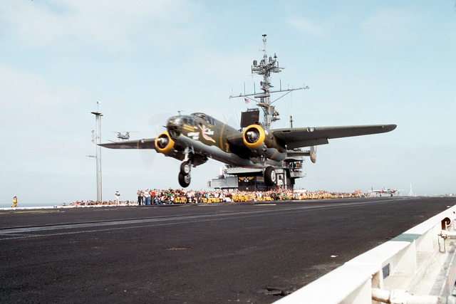 a restored b 25 mitchell bomber aircraft takes off from the deck of the aircraft c3176e